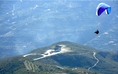 A paraglider over Otívar
